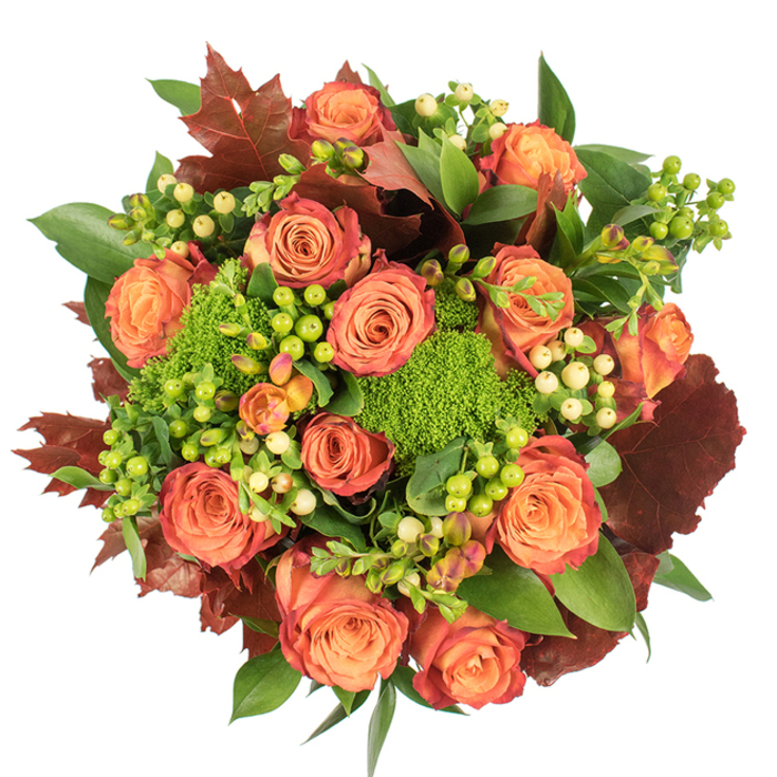 From a top-down perspective, this autumn bouquet reads like a small harvest laid out on a crisp white canvas-textured, warm and deliberately abundant. The eye is first captured by the many large roses, each blossom opening from a soft peach heart into coral and richer orange tones, with outer petals edged in a rusty red that suggests leaves catching the last light of day. Interspersed between those blooms are tight clusters of round berries-some startling lime green, others a gentle cream-yellow-whose smooth skins contrast with the roses' velvety petals. Dense clumps of Green Trick dianthus appear as bright, cushion-like green forms, their unusual texture reminiscent of moss or miniature green fireworks, and they punctuate the design with lively colour and tactile interest. A generous variety of fresh green foliage provides foundation and shape, while larger, lobed leaves in deep burgundy and russet are placed to echo autumnal maples and oaks, lending a seasonal silhouette to the round arrangement. The lighting is soft and even, sculpting each petal and berry into a study of shadow and highlight, while the bouquet's scent combines the soft perfume of roses with a faint, earthy green note. Crafted for an evocative seasonal display, the piece suits a Thanksgiving table, a cosy dining room centrepiece, or a thoughtful seasonal gift for neighbours in Anerley and around Crystal Palace, evoking the comfort of harvest gatherings and late-September strolls beneath turning leaves.